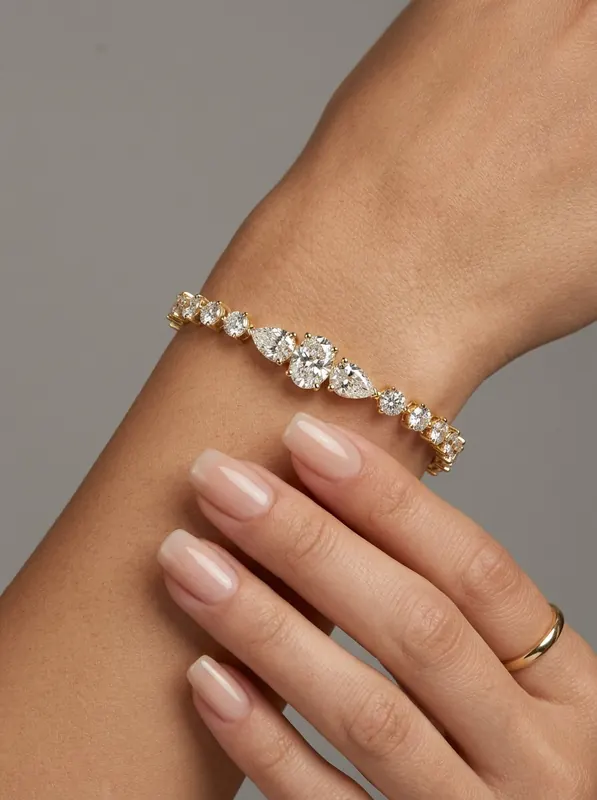 BR-08 round pear gulguld tennisarmbånd på hånd